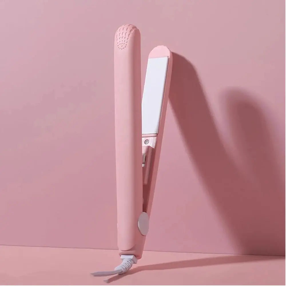 Pink ceramic flat iron hair straightener with white floating plates and cord