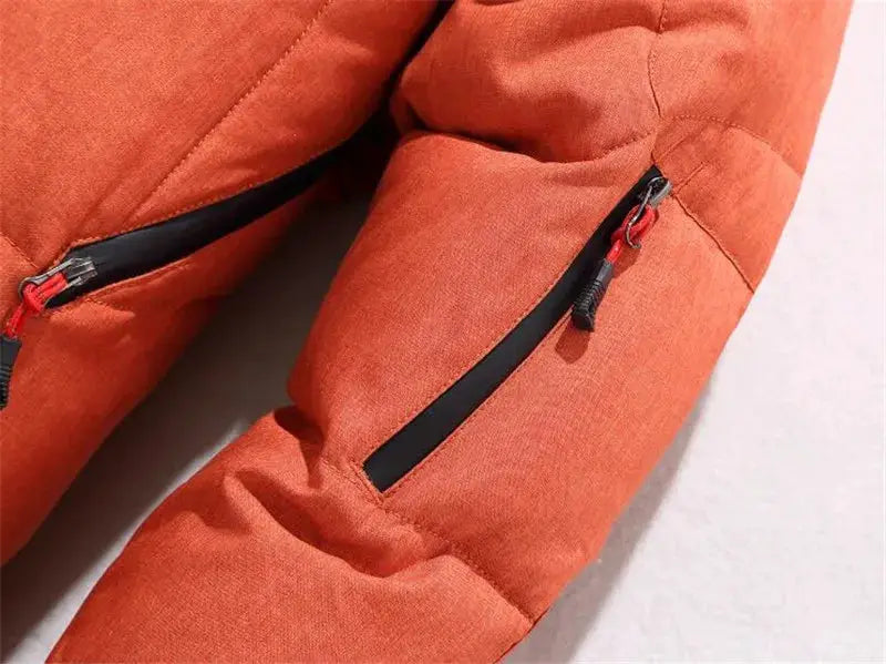 Men's orange hooded down jacket with black zippered sleeve pockets; padded winter outerwear