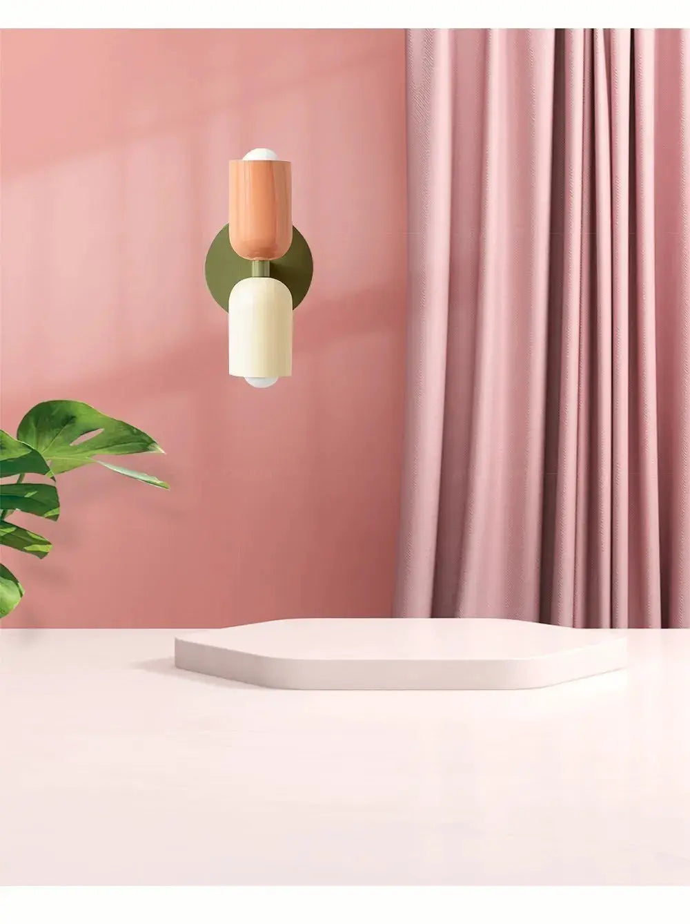 Nordic LED wall lamp with double cream and peach heads on a green circular backplate, minimalist living room lighting.