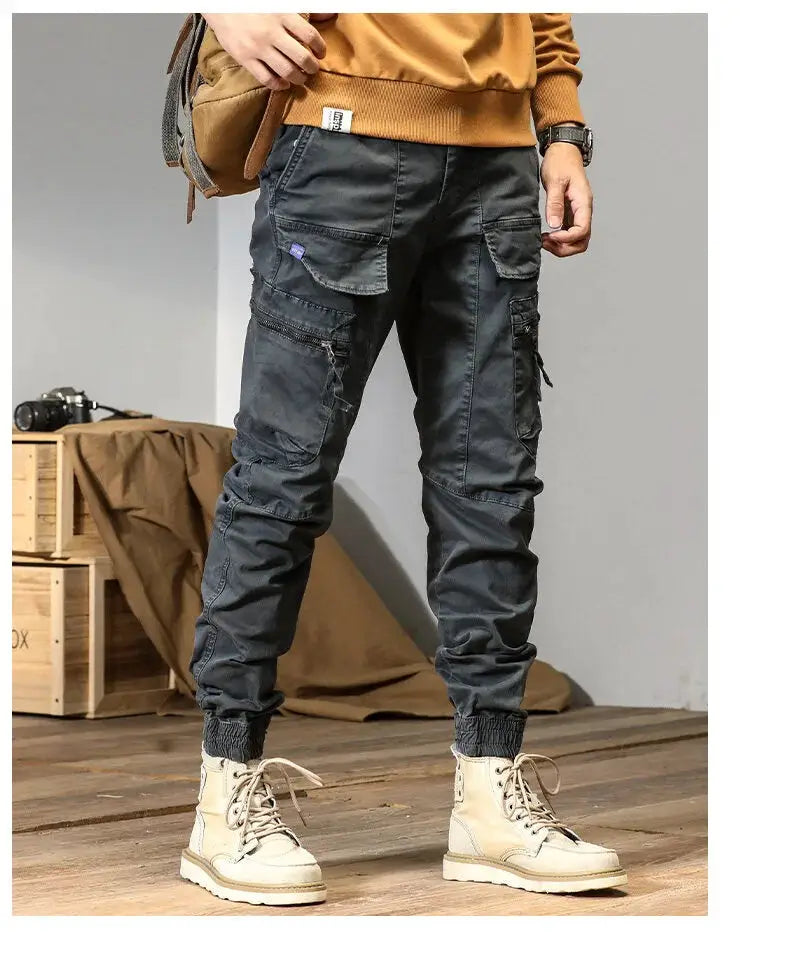 CAAYU gray cargo joggers for men with multiple pockets, elastic cuffs and zip cargo panels