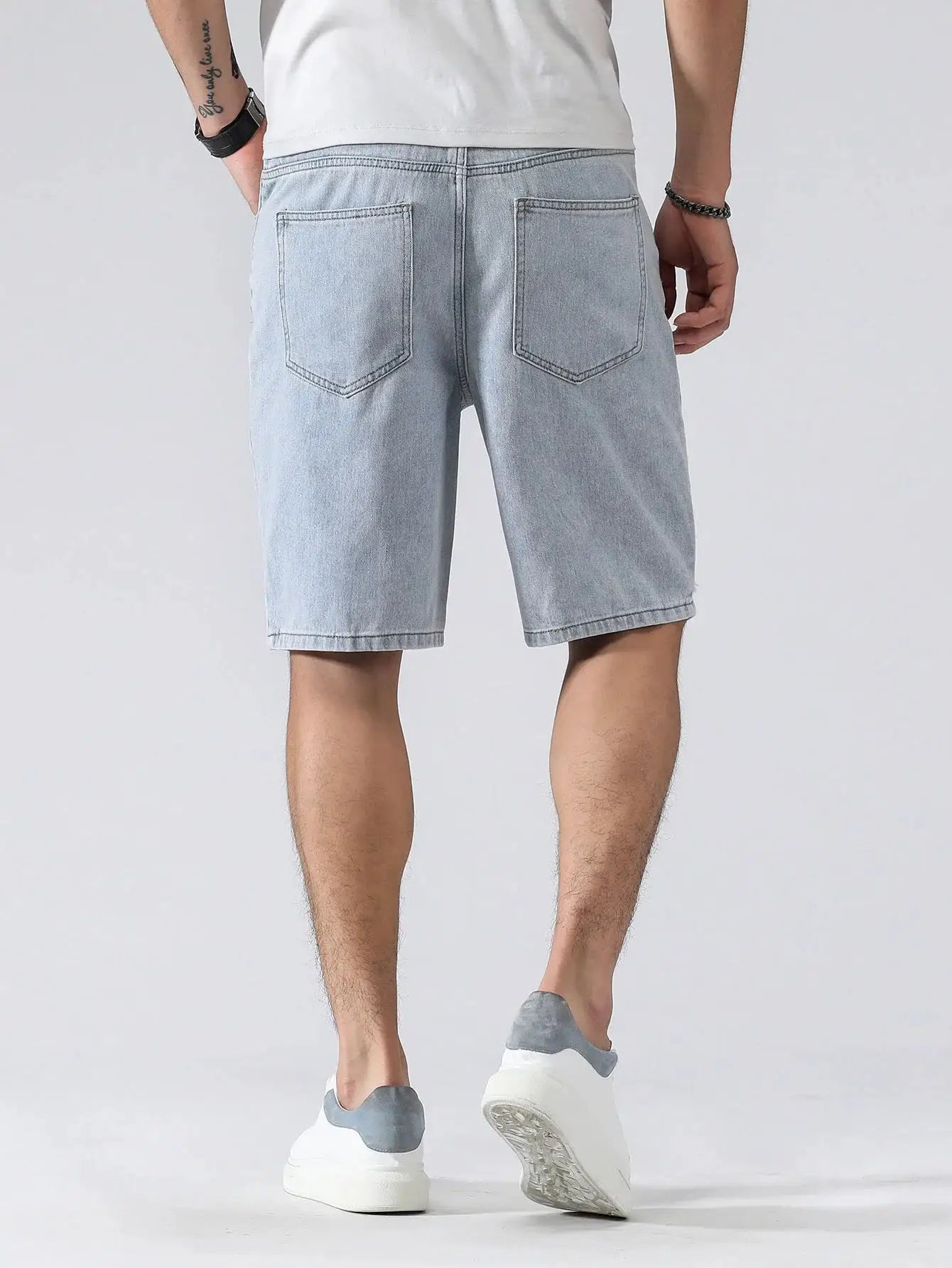 Men's light blue denim shorts, knee-length baggy fit with two back pockets; casual Simples Market shorts