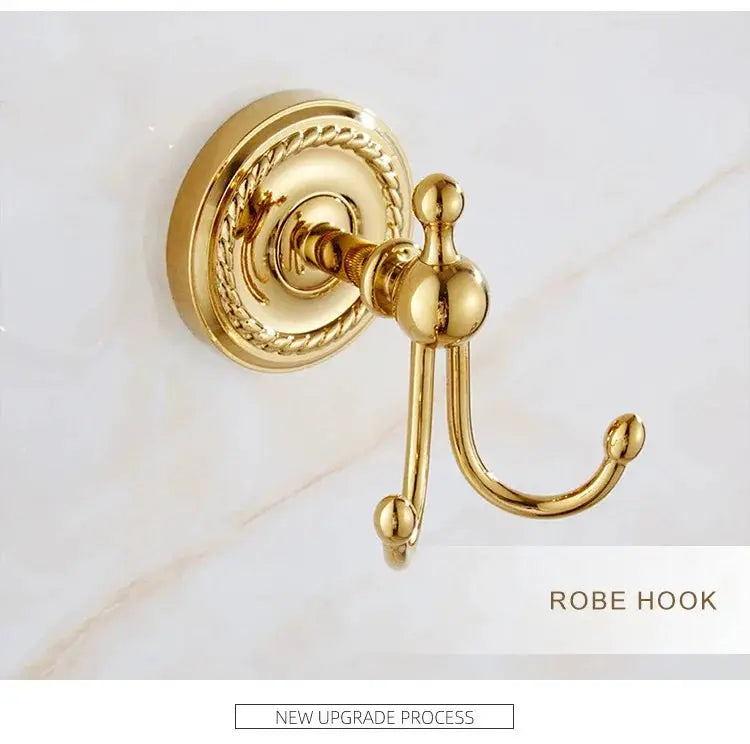 Robe hook in luxury gold brass with ornate round backplate, wall-mounted