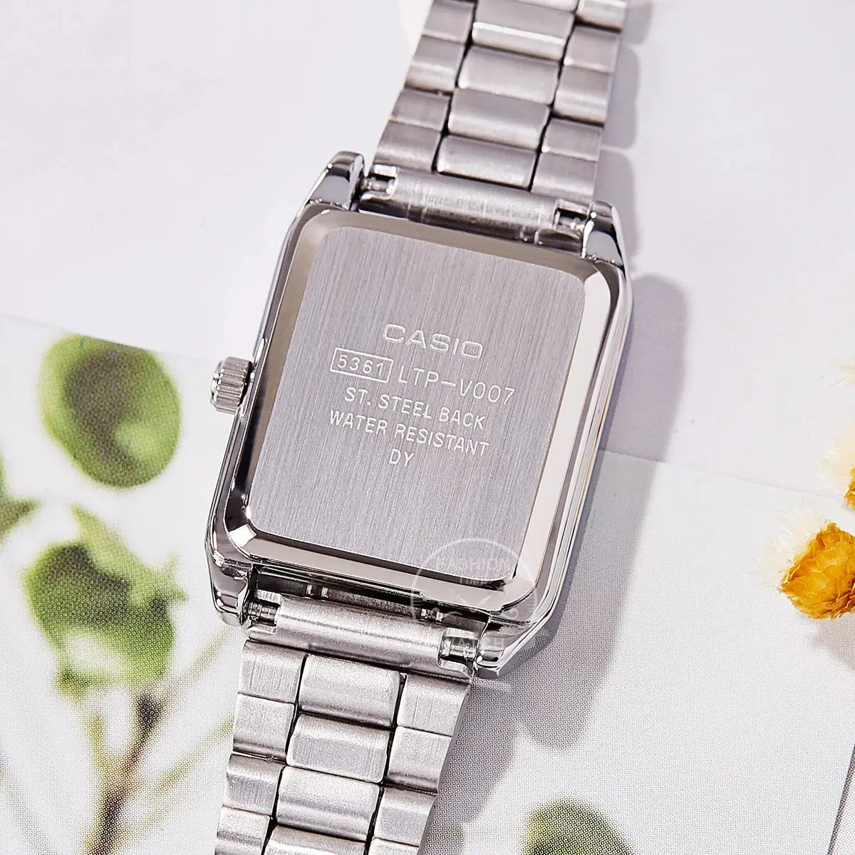 Casio women's stainless steel watch with tonneau case and metal bracelet; water resistant