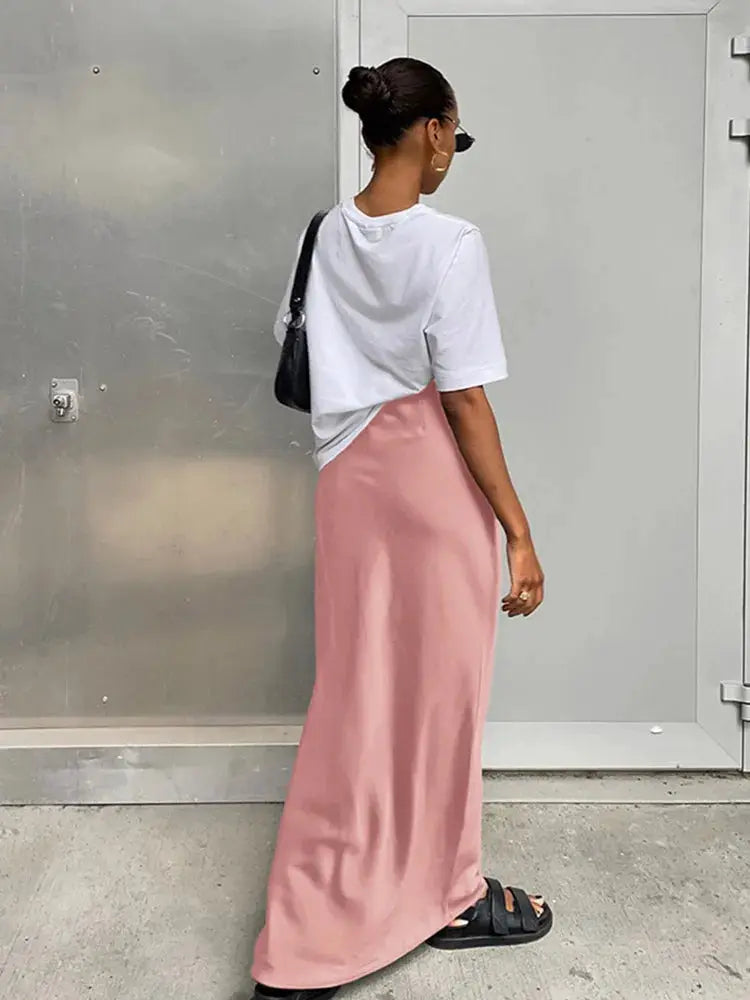 Satin pink maxi skirt with high waist, floor-length silhouette
