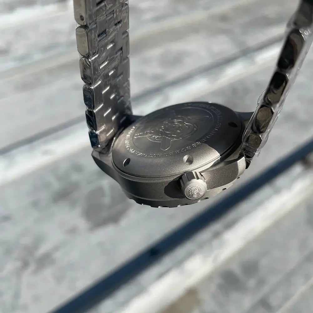 Steelflier SF752 mechanical wristwatch; stainless steel case and bracelet, back view with crown logo.