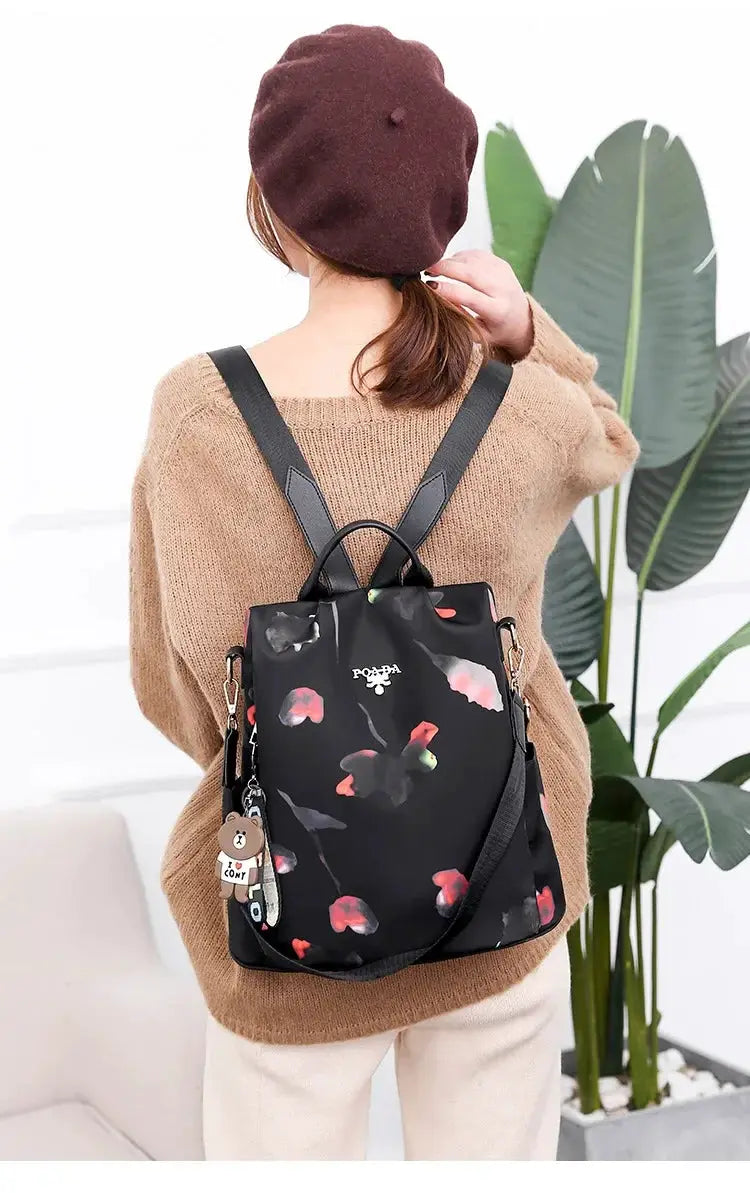 Women’s Oxford cloth backpack in black with pink floral print, large-capacity travel bag