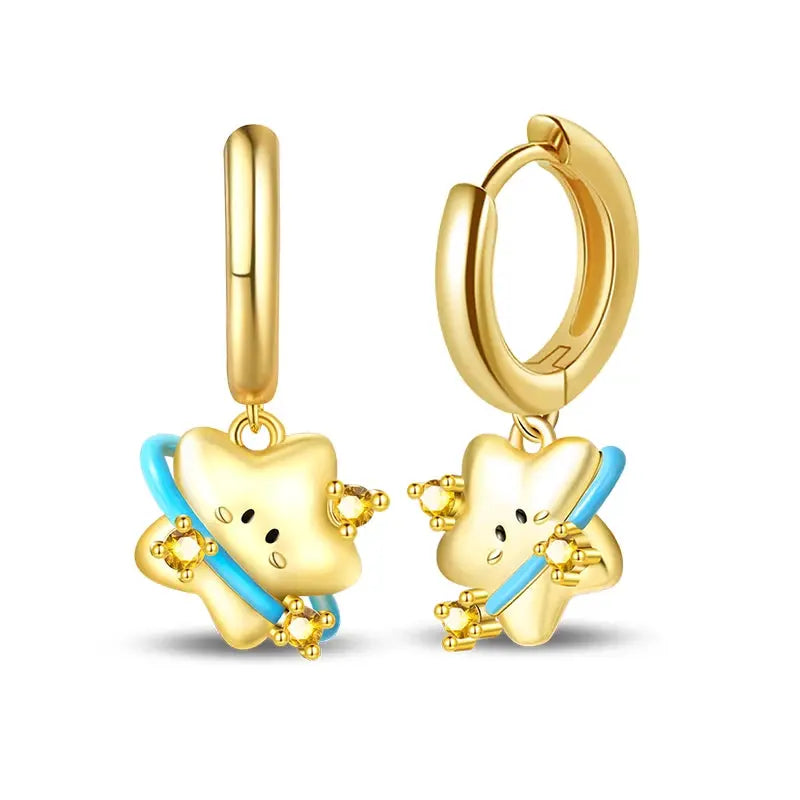 Golden-tone hoop earrings with star charms and blue enamel stripe, crystal accents, Simples Market pair.