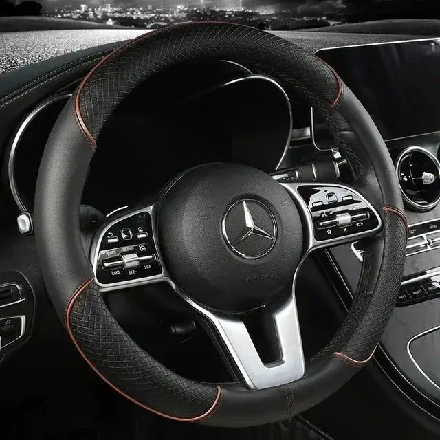 Steering wheel cover 38cm microfiber leather, black with orange stitching; Mercedes interior.