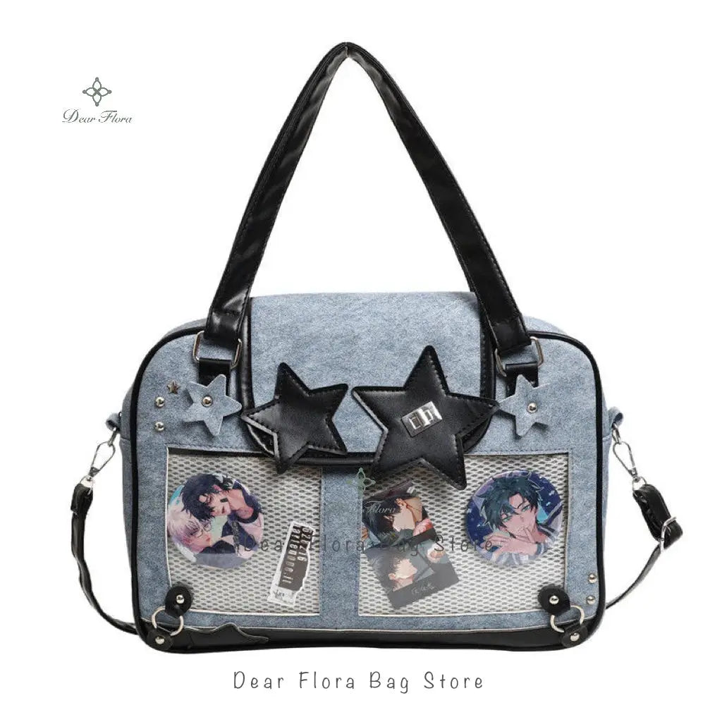 Y2K star ita bag in denim blue with black handles, star patches, and clear mesh pockets showing anime cards