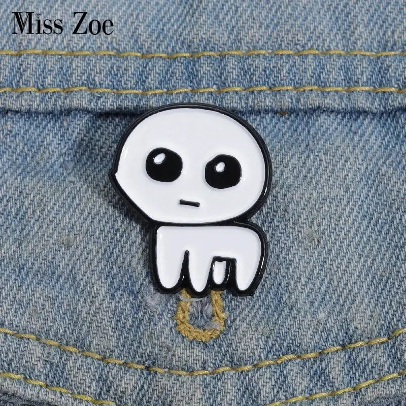 Autism awareness enamel pin by Miss Zoe; white zinc-alloy character with large black eyes and glossy enamel finish.