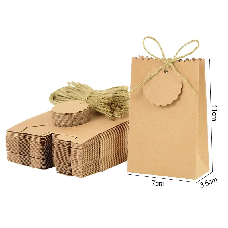 Simples Market kraft paper gift bag with rope handle, 11cm tall, paired with stacked kraft gift boxes.