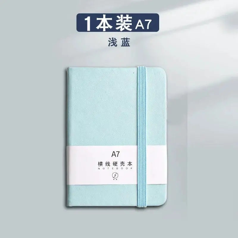 A7 mini notebook with light blue cover and elastic band, portable pocket diary with 96 sheets