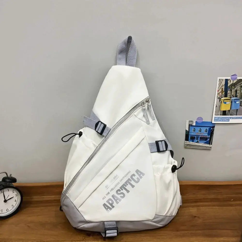 Unisex white nylon Y2K crossbody bag with diagonal zip, gray straps, and APASTICA logo