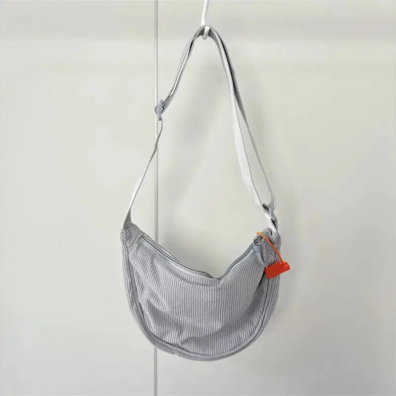 Corduroy hobo shoulder bag for women, gray crossbody style with orange tag
