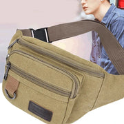 Canvas waist bag by Simples Market in khaki with brown strap and multiple zip pockets.