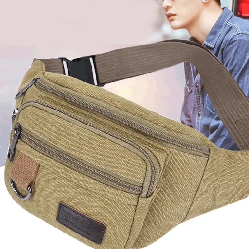 Canvas waist bag by Simples Market in khaki with brown strap and multiple zip pockets.