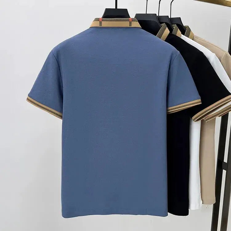 Short sleeve polo shirts; five assorted colors on a rack, front blue polo with beige trim, silk-cotton fabric