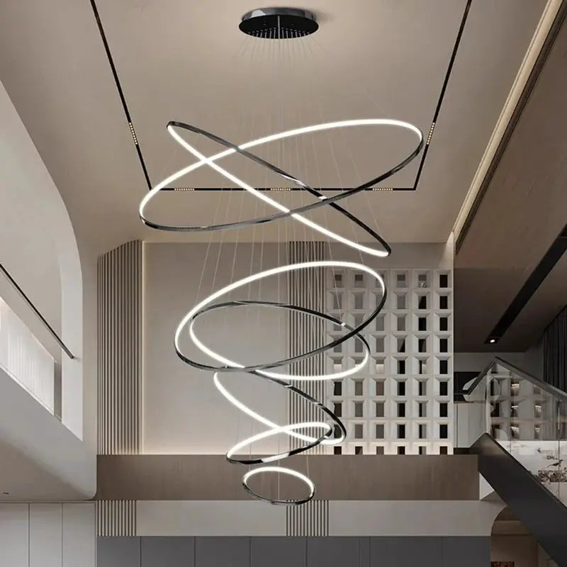 Modern spiral LED pendant light with chrome rings, hanging living room chandelier.