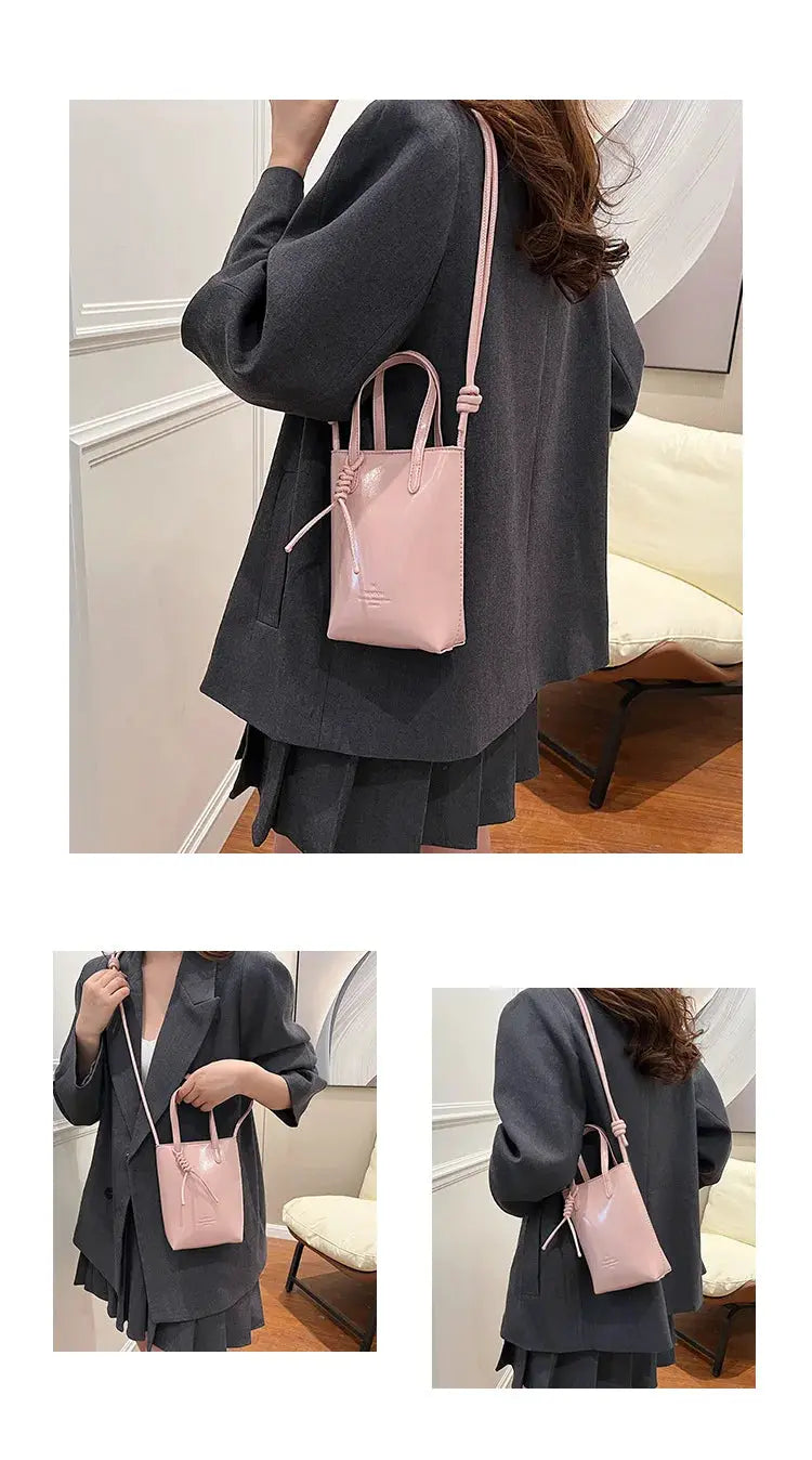 PU leather mini crossbody bag in pink by Simples Market with top handles and long adjustable strap
