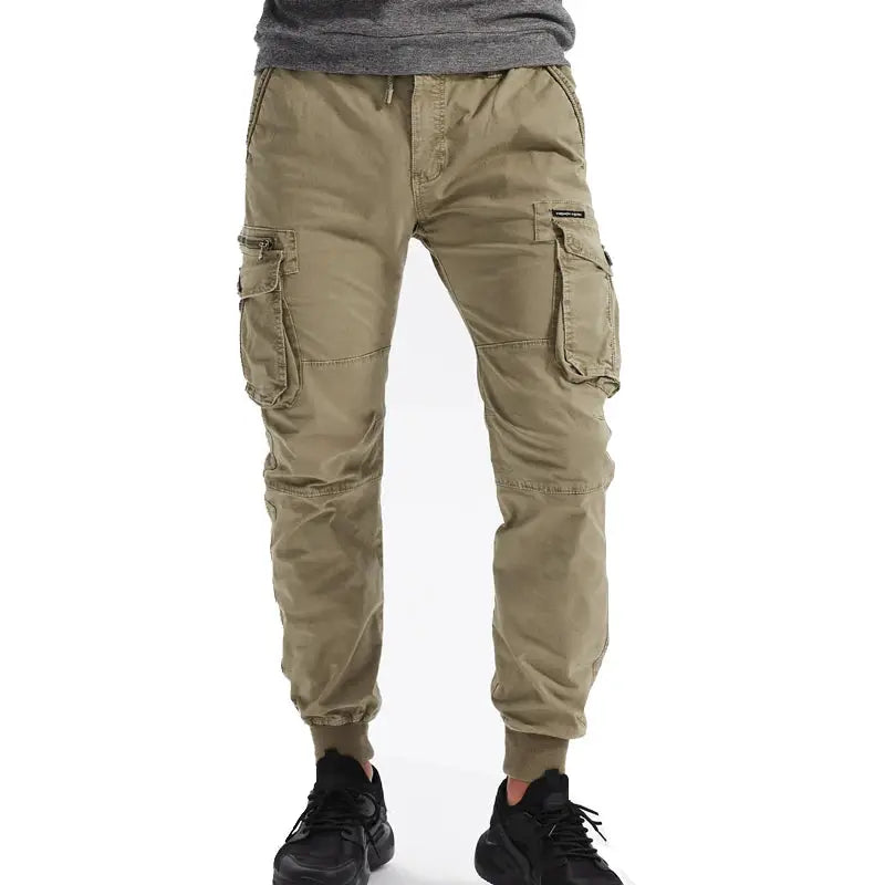 Men's cotton cargo jogger pants in khaki by Simples Market with multiple pockets and cuffed ankles.