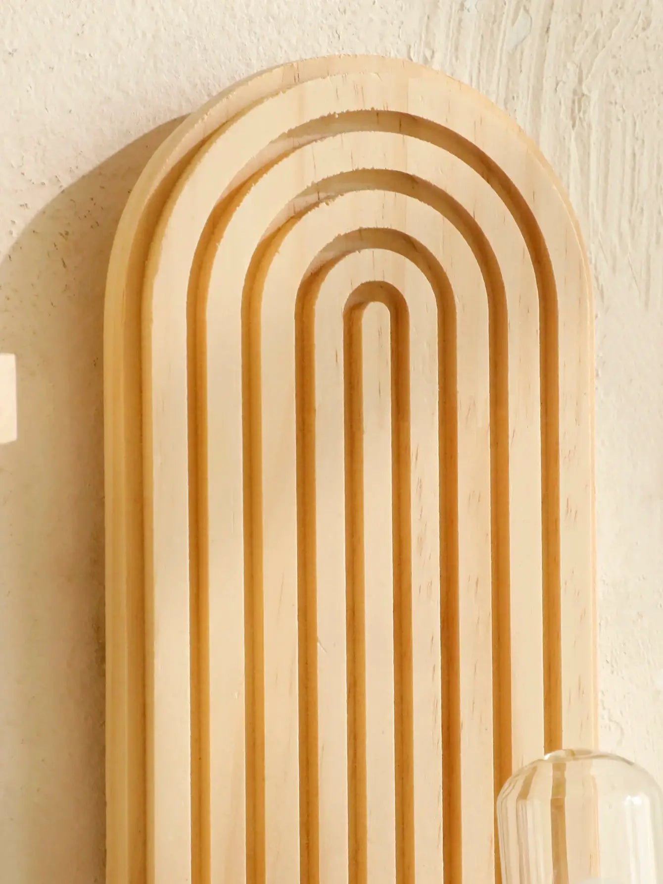 Geometric boho-style wooden wall shelf with nested arches in natural wood finish