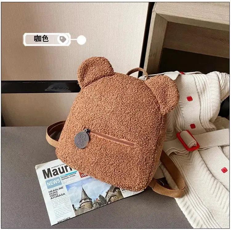 Bear-ear fleece backpack for kids, tan brown plush lambswool with front zip pocket and bear-shaped zipper pull
