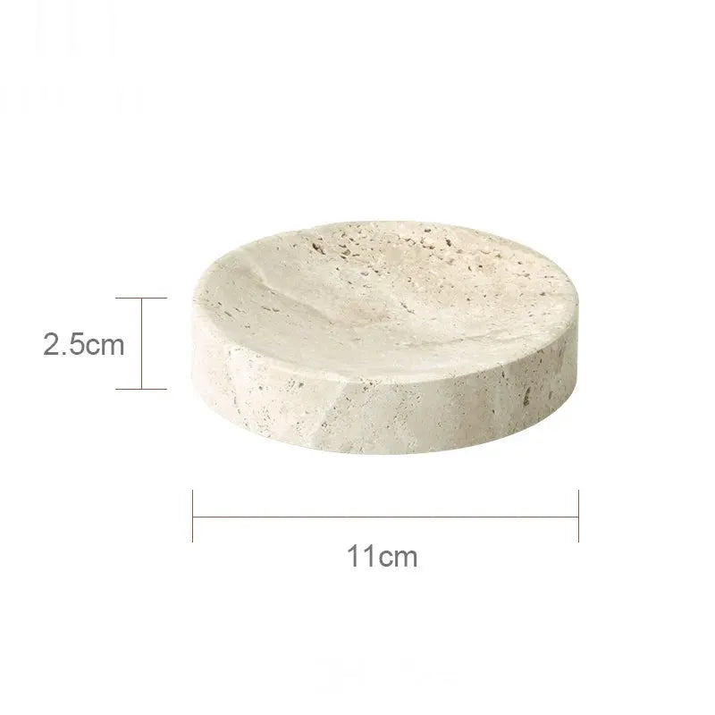 Round beige travertine bathroom soap dish, 11 cm diameter, 2.5 cm high.