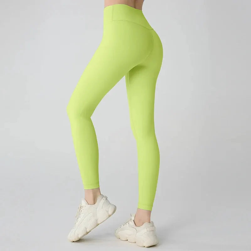 Women's lime green high-waisted yoga leggings, breathable fabric for workouts, running and cycling.