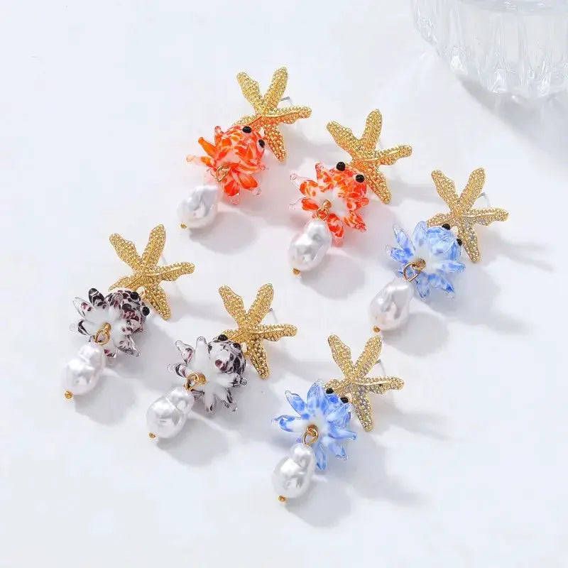 Cute octopus glass drop earrings with pearl drops and gold starfish accents in assorted colors