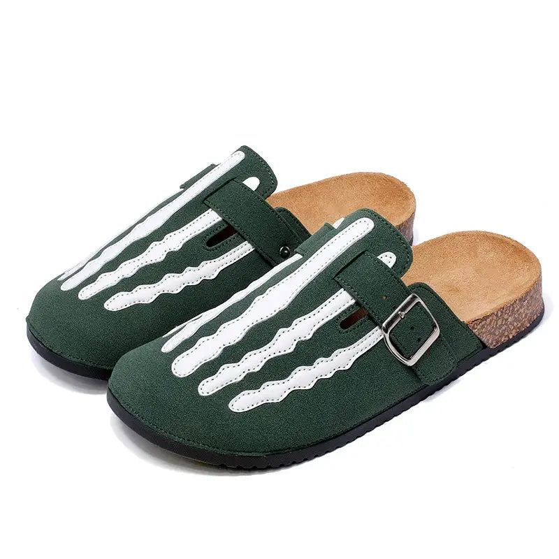 Pair of green cork-footbed clogs with white stitched straps and adjustable buckle