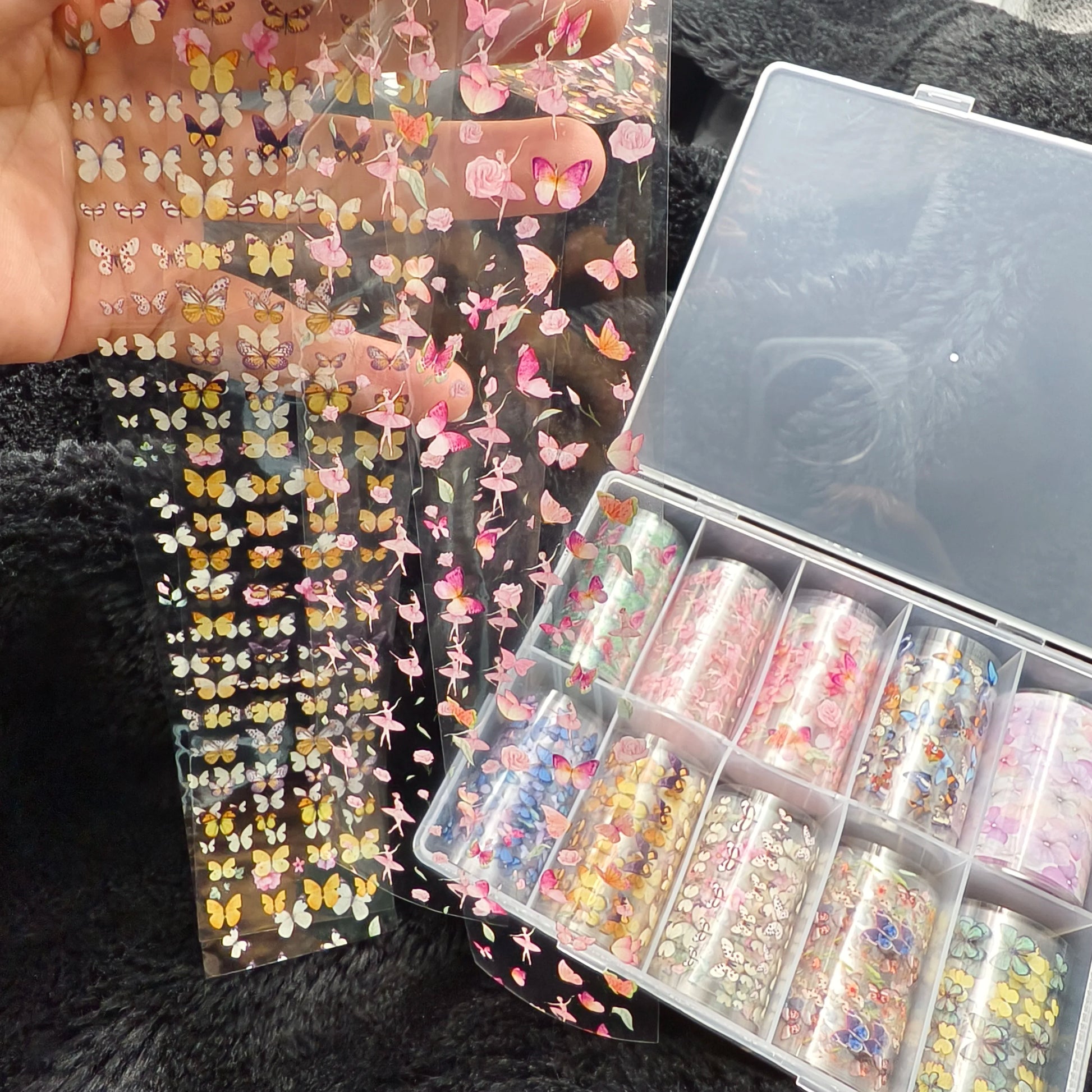 Nail art decals from Simples Market: butterfly and floral foil stickers on clear sheets, pink/yellow hues
