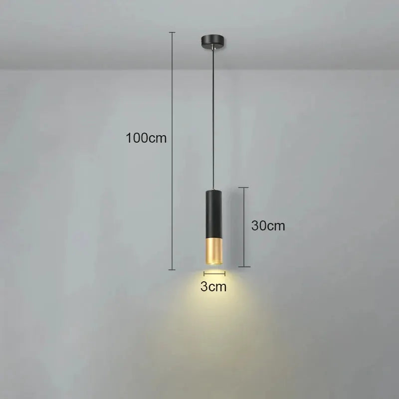 Nordic LED pendant light by Simples Market; black cylindrical shade with gold bottom, 3 cm dia, 30 cm height.