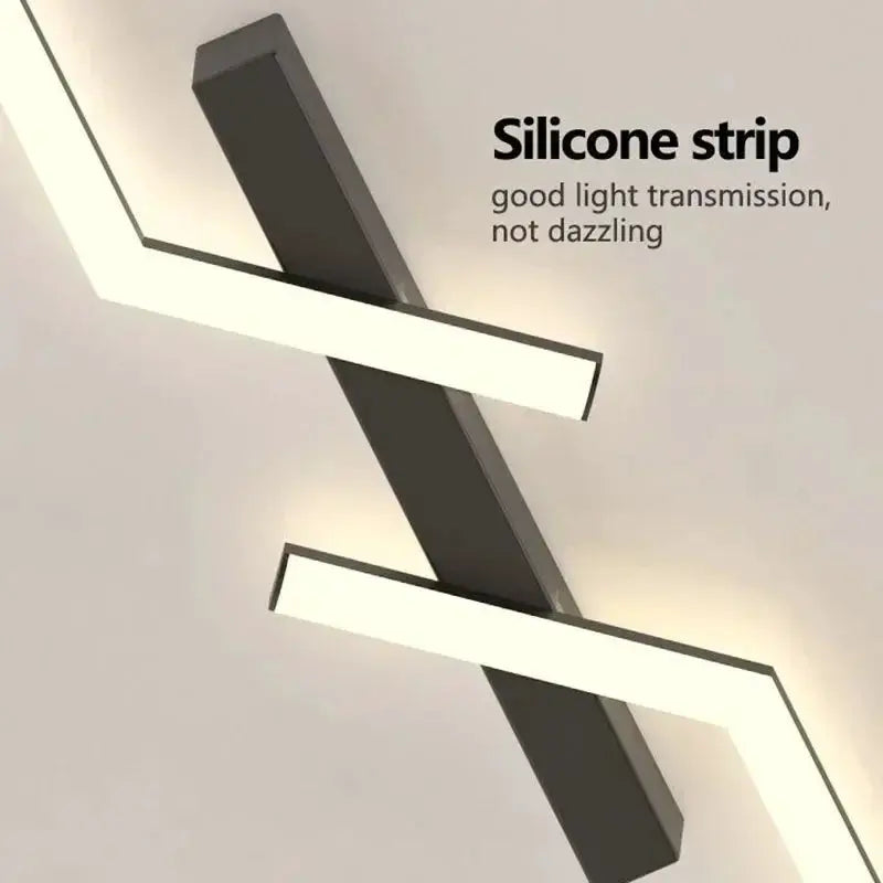 Modern LED ceiling light with gray metal crossbar and white LED strips in zigzag design