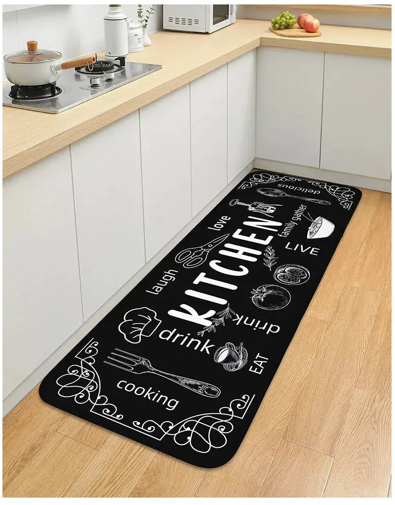 VIKAMA kitchen carpet by Simples Market, black non-slip absorbent floor mat with white cooking icons and words.