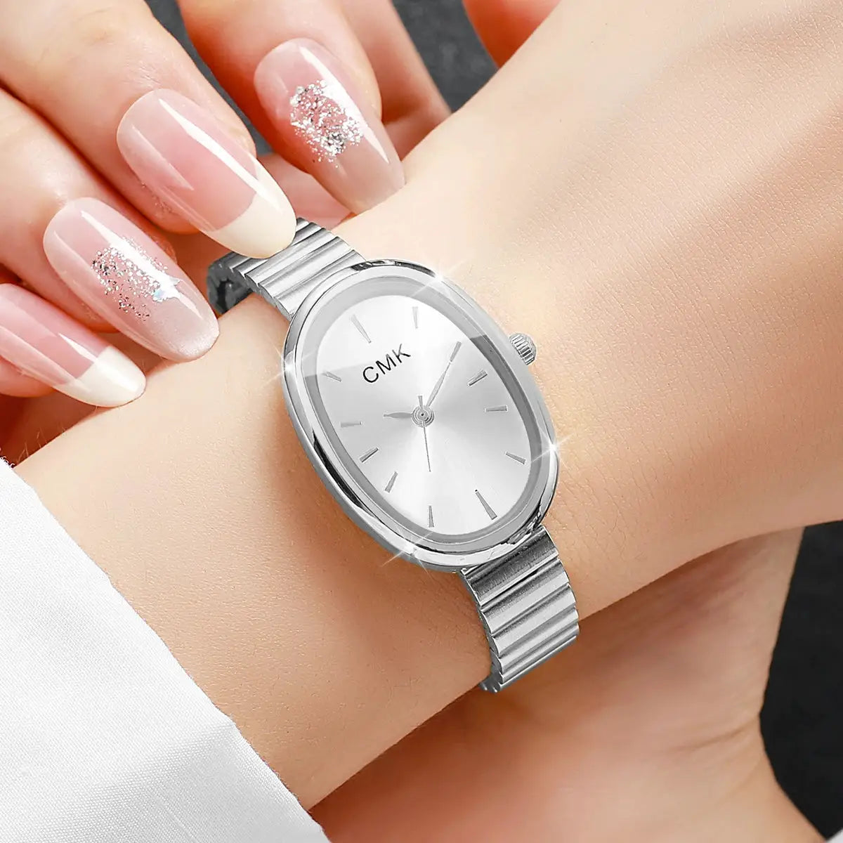 CMK oval-dial women's wristwatch with a slim silver metal strap