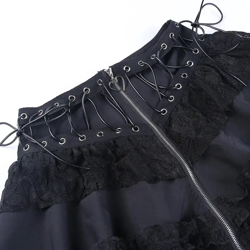 Gothic skater punk black high-waist skirt with front zipper, lace trim and lace-up corset detail.