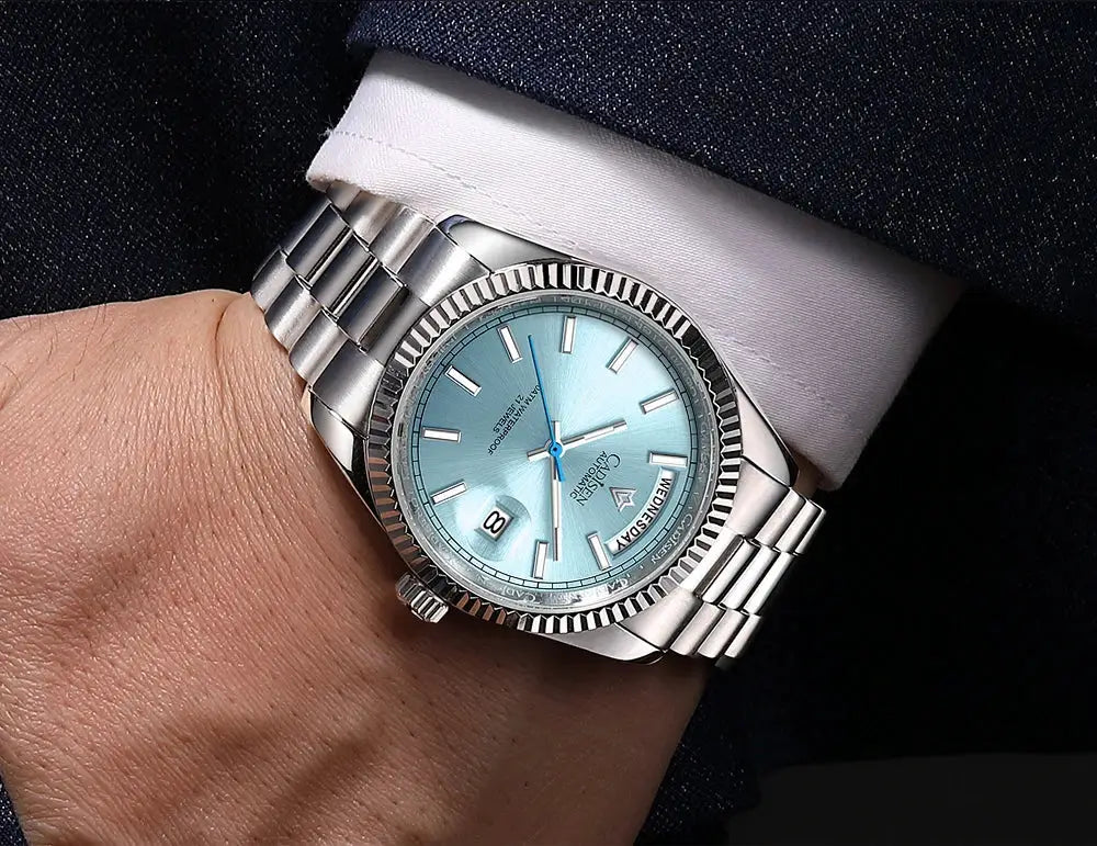 CADISEN DD40 men's stainless steel watch with light-blue dial, blue hands, and date window