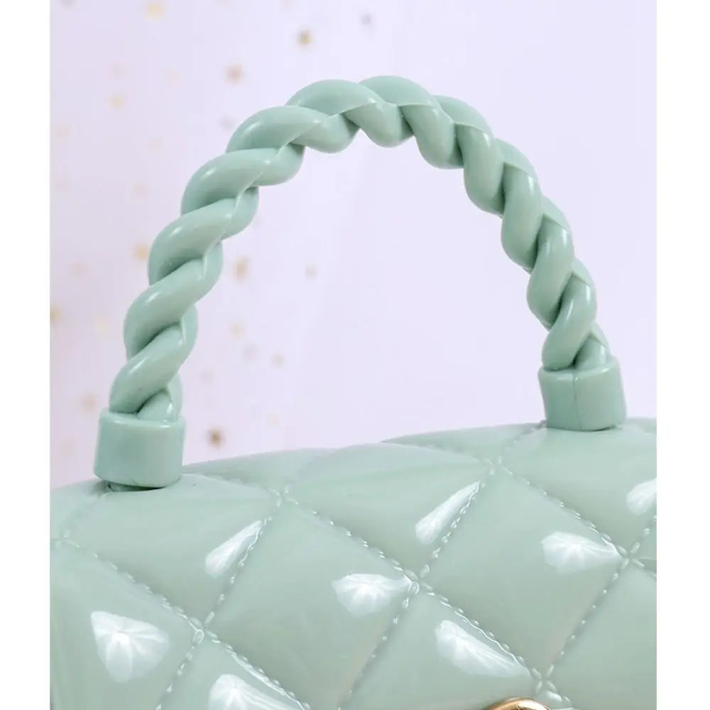 Kids PU leather crossbody bag in mint green with a chunky braided handle and quilted pattern