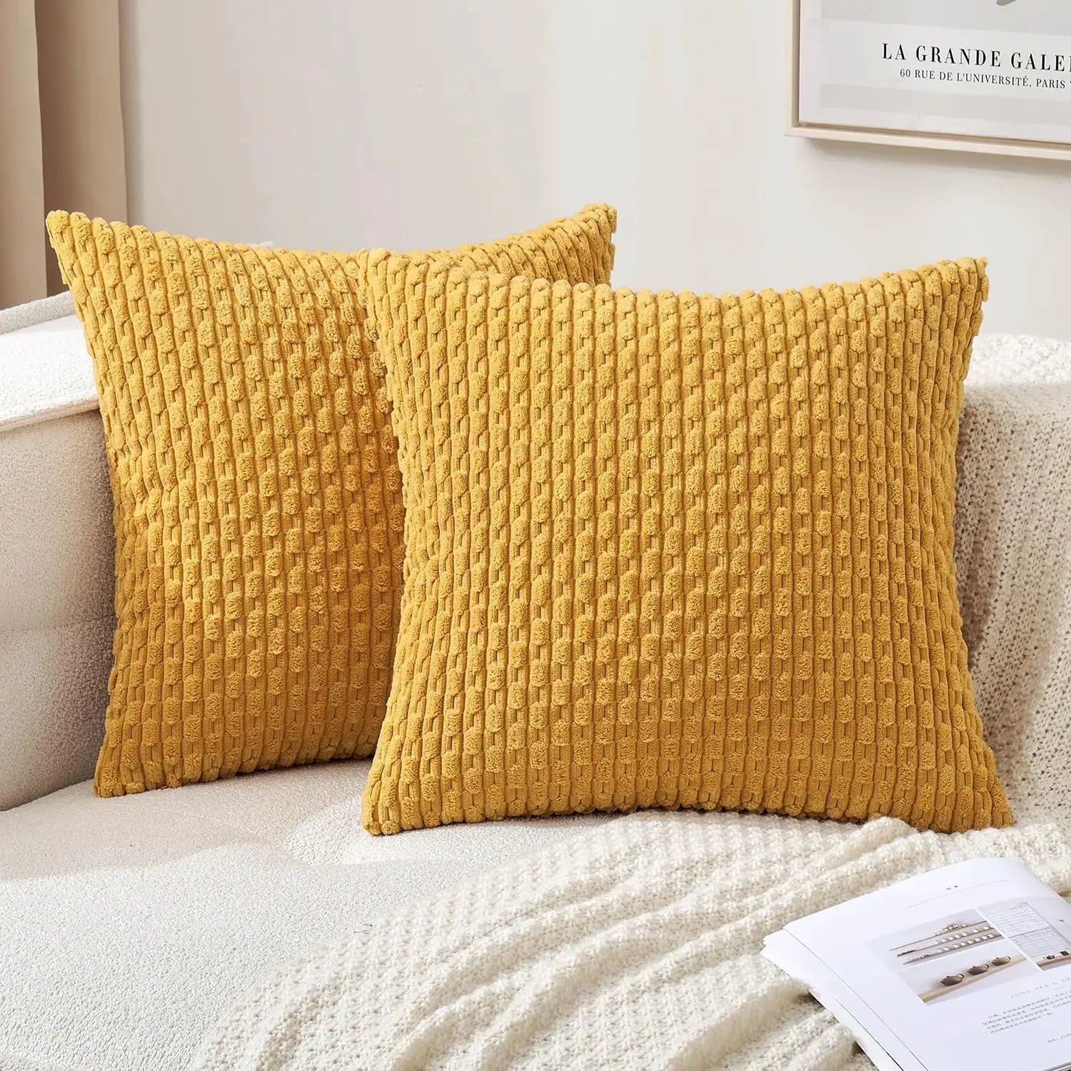 Throw pillow covers; mustard yellow corduroy with raised rectangular texture, 2-pack on sofa.