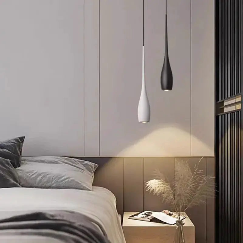 MARPOU LED pendant lights, white and black teardrop pendants with adjustable height for a modern minimalist bedroom.