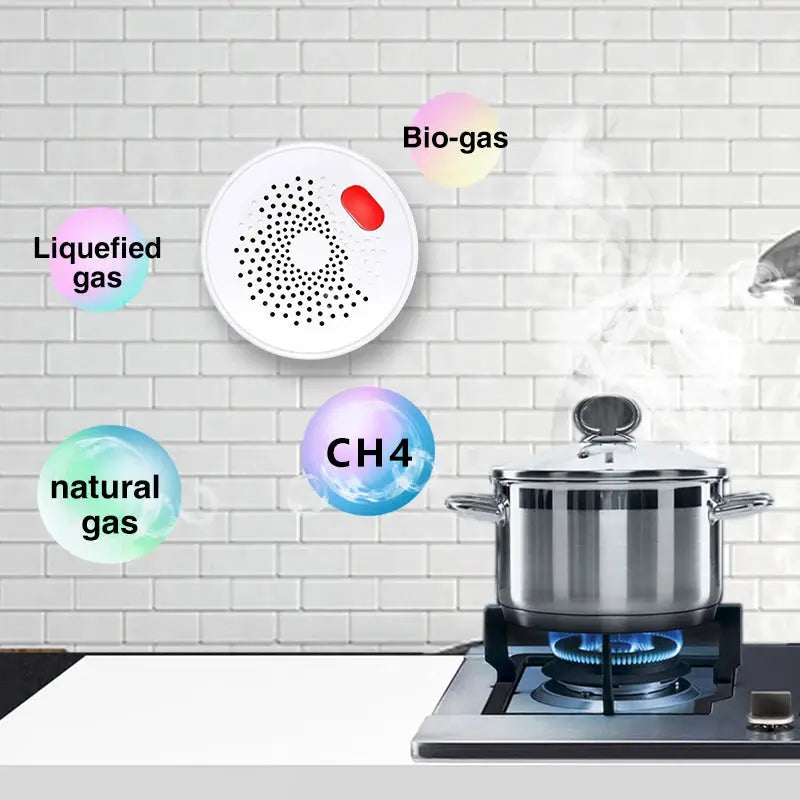 Tuya Smart gas leak detector by Simples Market; white circular wifi sensor on tiled kitchen wall near a gas stove