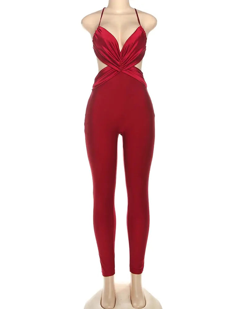 Red silky jumpsuit with cross-pleated front, halter-neck straps, and skinny legs