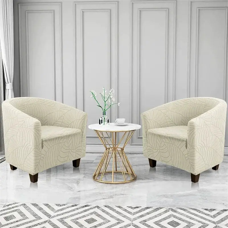 Pair of beige elastic club chair slipcovers with leaves jacquard pattern