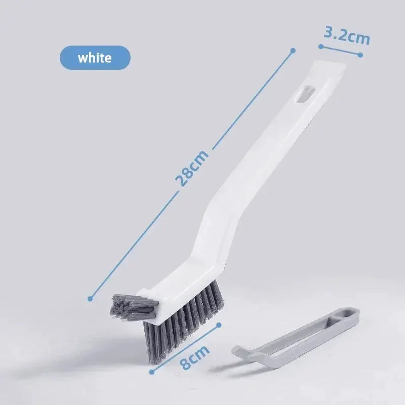 2-in-1 cleaning brush for corners and gaps; white handle with gray bristles, 28 cm long, includes detachable scraper.