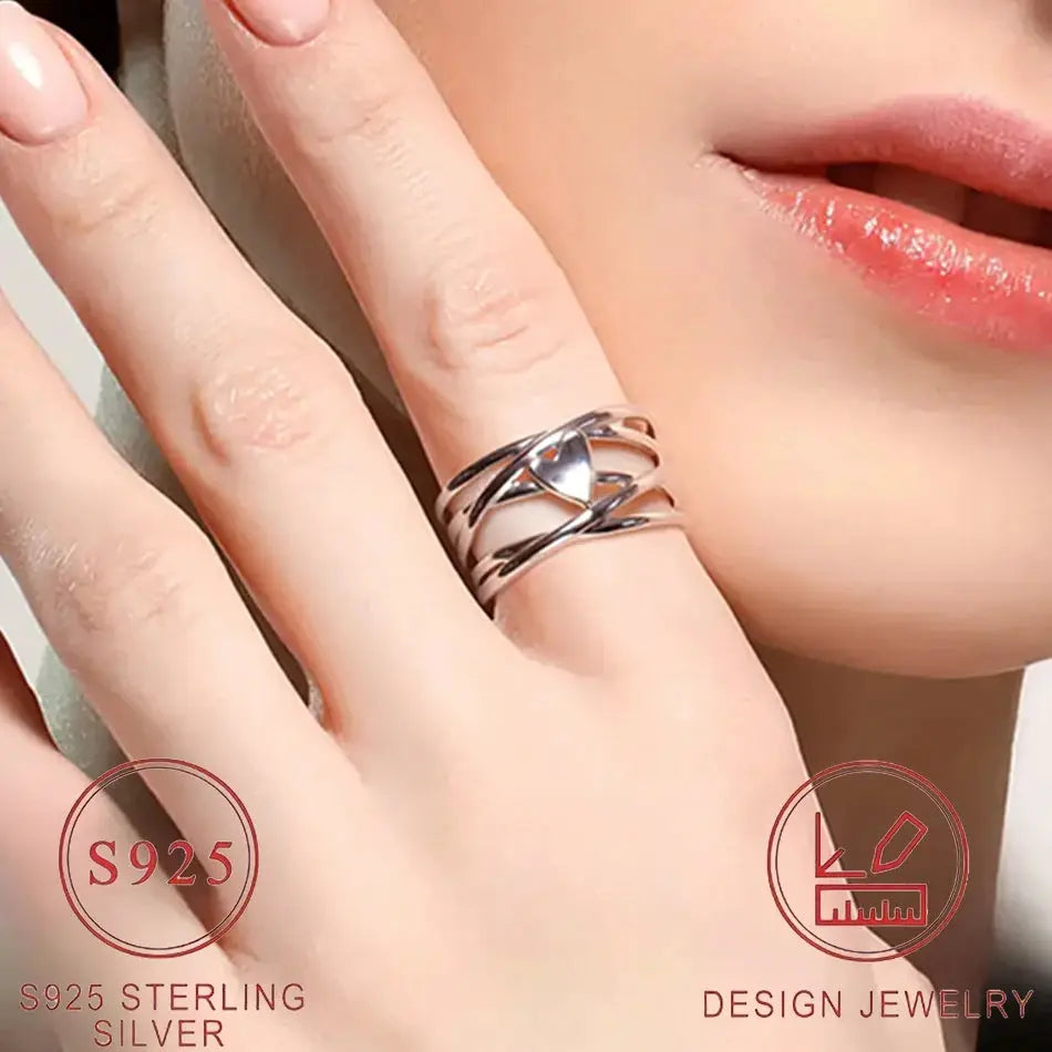 Sterling silver heart-shaped ring with intertwined bands, S925 stamped, design jewelry.