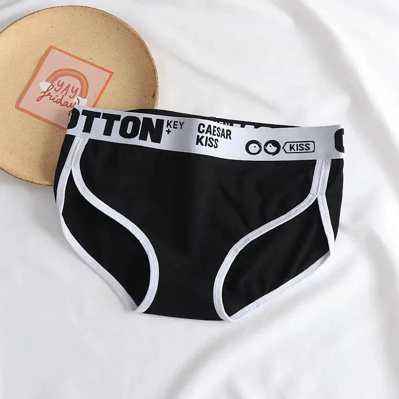 Women's black cotton briefs with white piping and elastic waistband