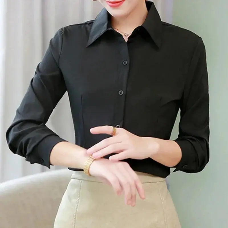Women's black long-sleeve shirt with collar and chest pocket