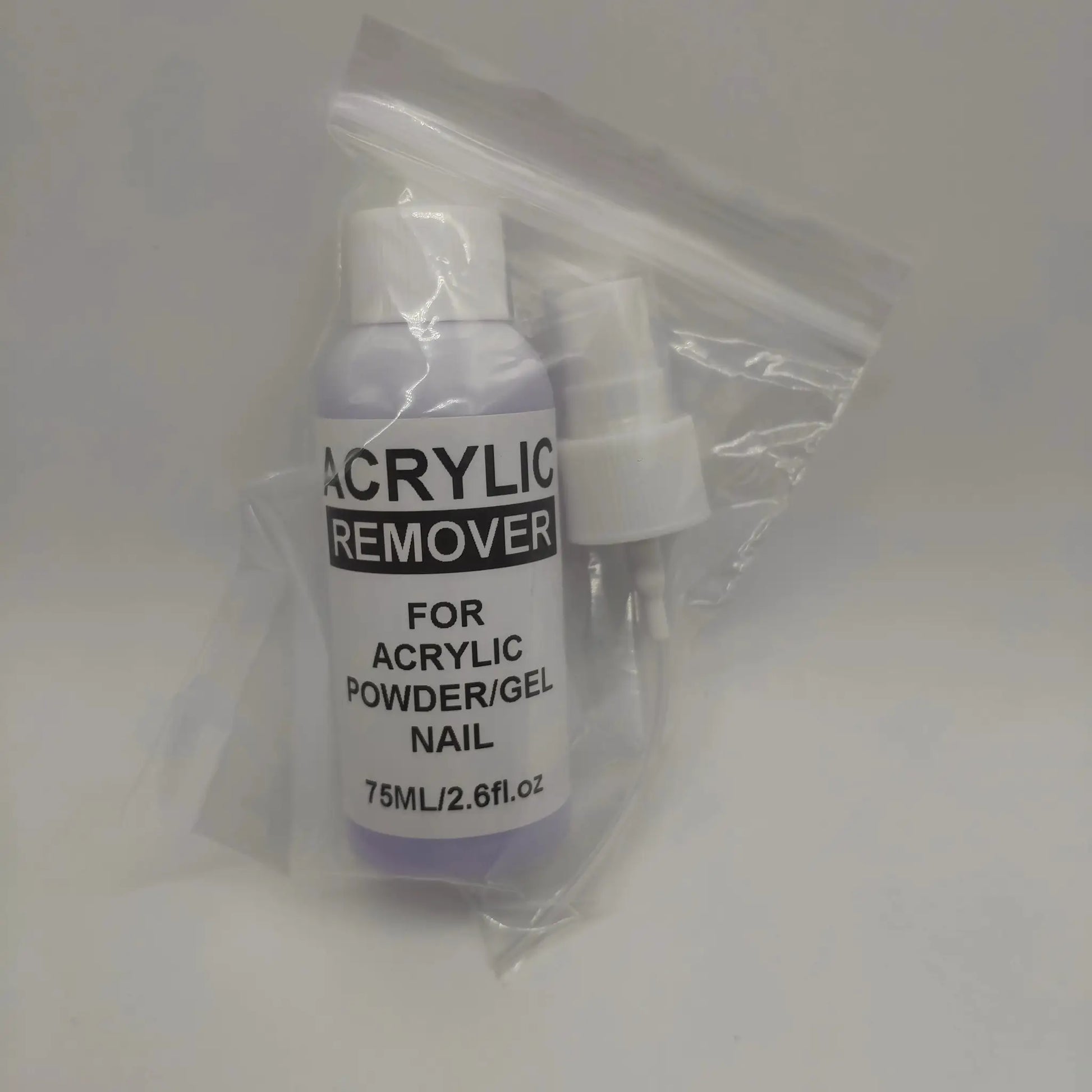 Acrylic remover bottle in a clear plastic bag; white bottle, 75 ml.