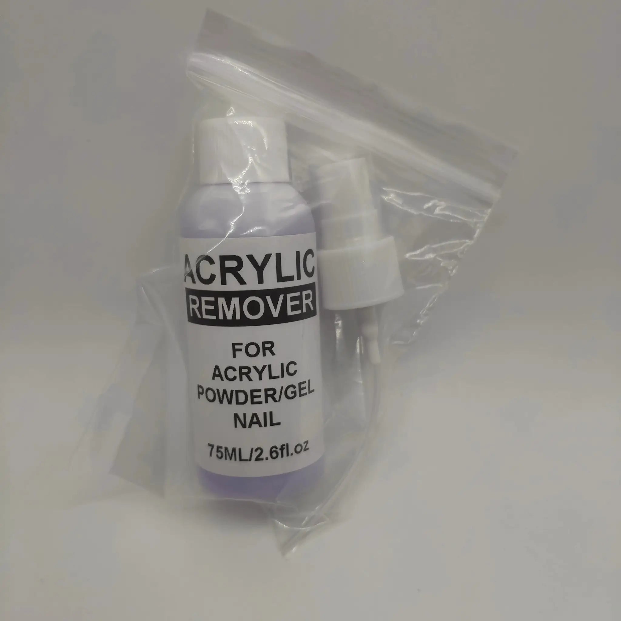 Acrylic remover bottle in a clear plastic bag; white bottle, 75 ml.