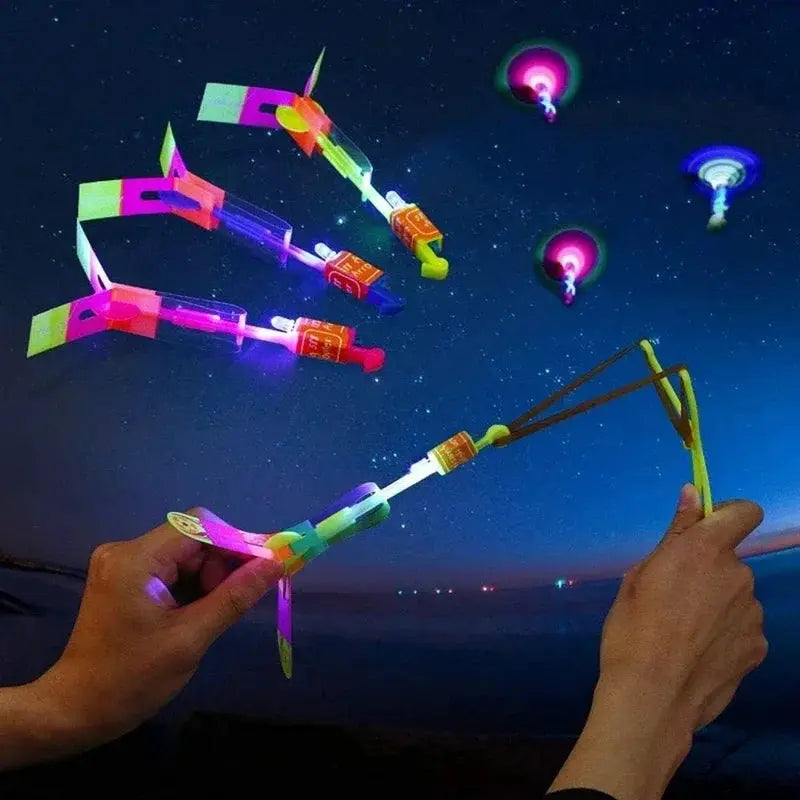 New Light Up Arrow Rocket Helicopter Flying Toys With LED Neon Glow For Parties And Gifts Rubber Band Catapult